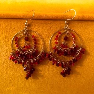 Gold wire and garnet beaded hanging hoop earrings. Medium sized hoops